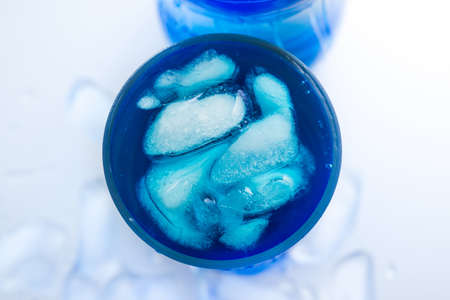 Ice and water in glass on white backgroundの写真素材