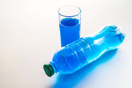 Bottle and glass of water on white backgroundの写真素材