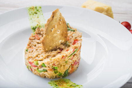 restaurant supply risotto with vegetables on white plateの写真素材