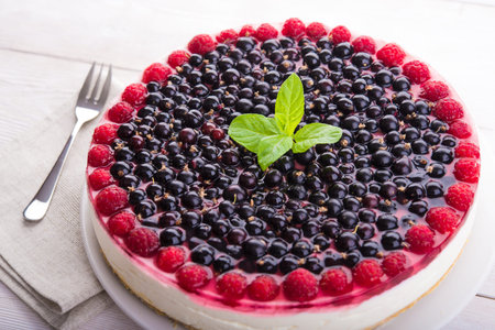 Closeup of dessert pie with berries on wood tableの写真素材
