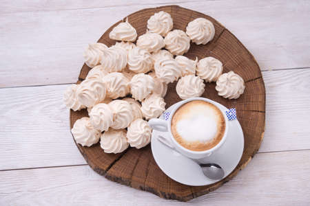 cup of cappuccino with zephyr on backgroundの写真素材