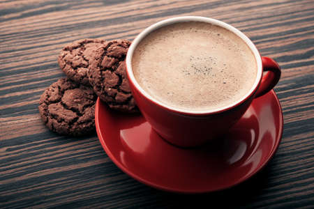 Espresso coffee with chocolate cookies on wood backgroundの写真素材
