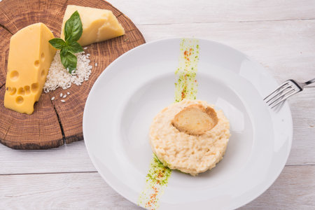 risotto with fresh vegetables in white plateの写真素材