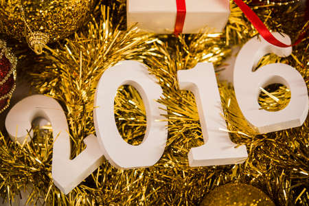 Christmas balls on abstract background with white figures 2016の写真素材