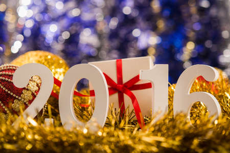 Christmas balls on abstract background with white figures 2016の写真素材