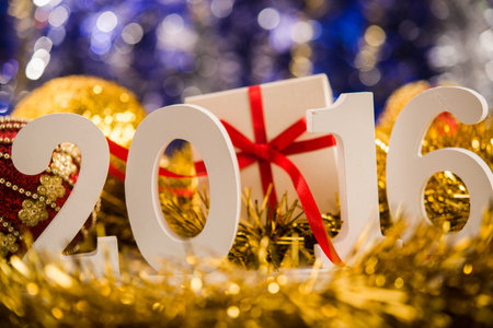 Christmas balls on abstract background with white figures 2016
