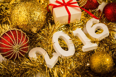 Christmas balls on abstract background with white figures 2016の写真素材