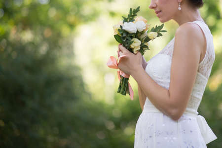 bride holding wedding flowers bouquetの写真素材