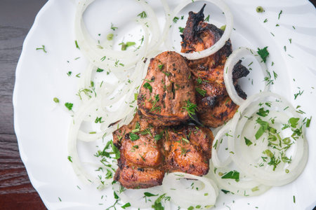 barbecue meat pieces on white tableの写真素材