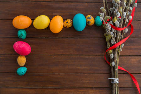 Easter eggs and willow tree on backgroundの写真素材