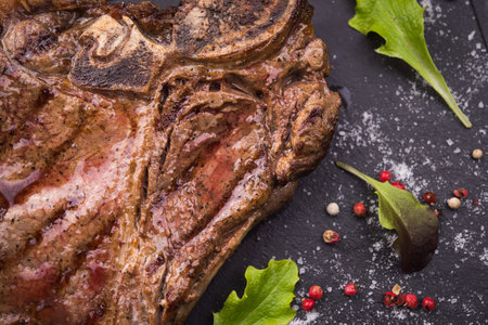 beef steak with green leaf on backgroundの写真素材