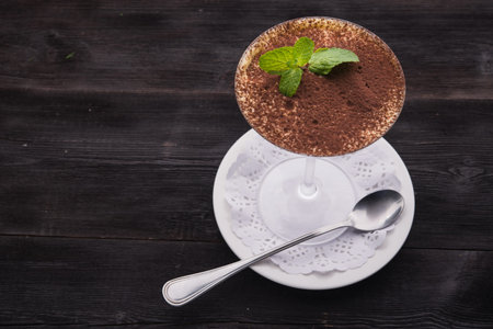 chocolate tiramisu with green mint in glass