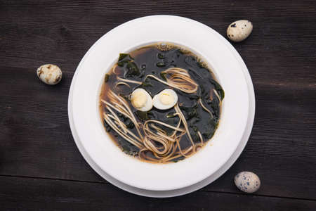 udon soup on wooden black tableの写真素材