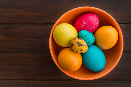 Easter eggs and willow tree on background