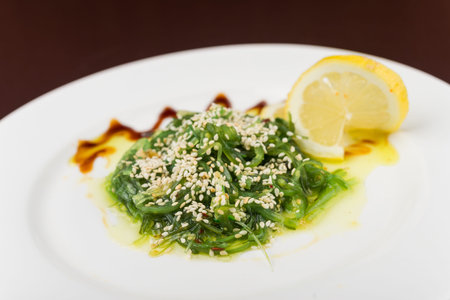 fresh chuka seaweed salad on white plateの写真素材