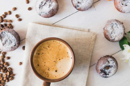 tasty cup of coffee and cakes on white boardの写真素材