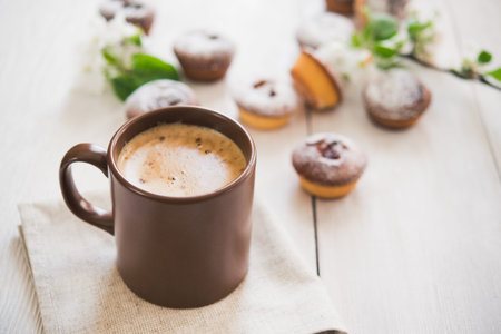 tasty cup of coffee and cakes on white boardの写真素材