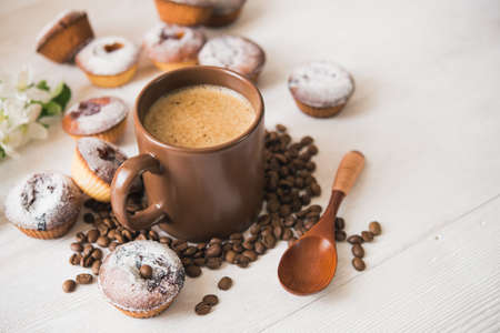 tasty cup of coffee and cakes on white boardの写真素材