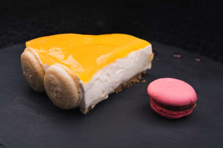 sweeet cheesecake with biscuit on black backgroundの写真素材