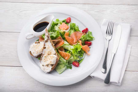 salmon salad with toasted bread in oil and soy sauceの写真素材