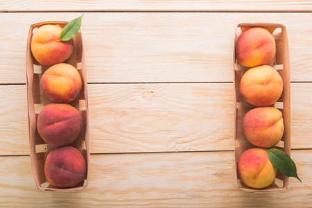 a lot of fresh peaches on a white tableの写真素材