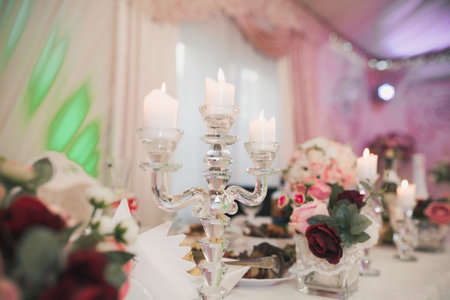 wedding table decoration. closeup of candlestick with candle.