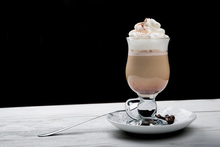 iced coffee frappe in glass on wood table