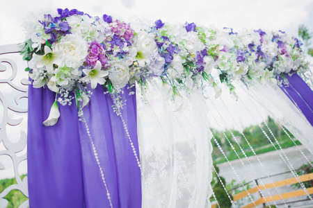Wedding ceremony outdoors. event decoration with flowersの写真素材