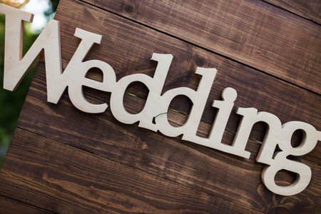 Wooden plaque wedding, beautiful decor in photo zone letters.