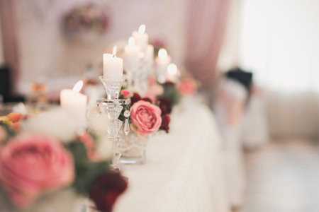 wedding table decoration. closeup of candlestick with candle.