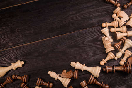 wood chess pieces on board game. brown vintage backgroundの写真素材