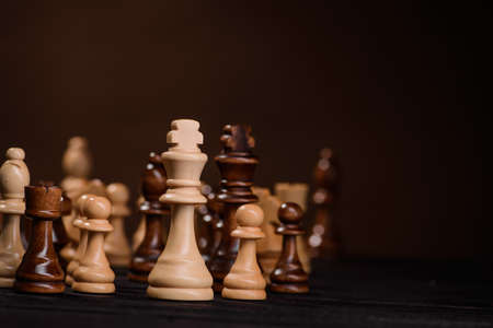 wood chess pieces on board game. brown vintage backgroundの写真素材