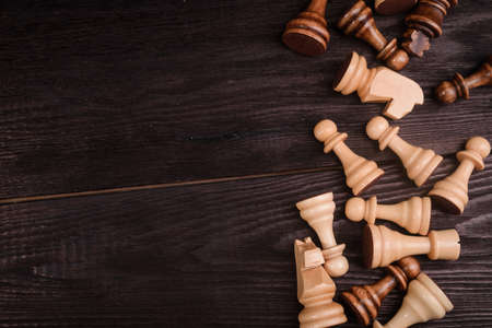 wood chess pieces on board game. brown vintage backgroundの写真素材