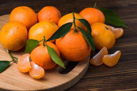 fresh orange tangerine on wood table. fruits backgroundの写真素材