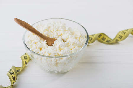 Fresh cottage cheese in a glass bowl. Diet background. healthy foodの写真素材