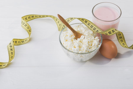 Dinner with cottage cheese, egg and yogurt. diet concept backgroundの写真素材