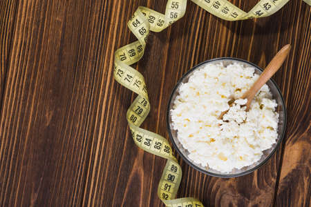 Fresh cottage cheese in a glass bowl. Diet background. healthy foodの写真素材