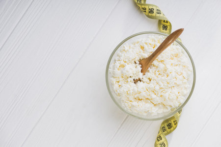 Fresh cottage cheese in a glass bowl. Diet background. healthy foodの写真素材