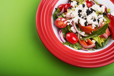 Delicious breakfast with vitamin salad with tomato onion and cottage cheeseの写真素材