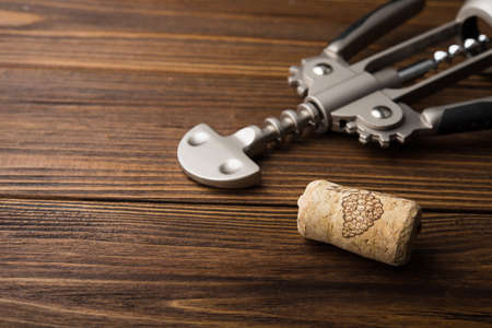 wine corkscrew on wooden table. alcohol backgroundの写真素材