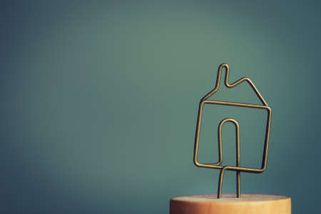 concept of small home. metal house icon symbolの写真素材