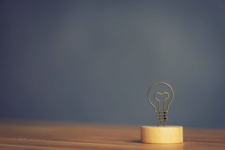 Close-up photo of lamp symbol. bulb icon with metal wire