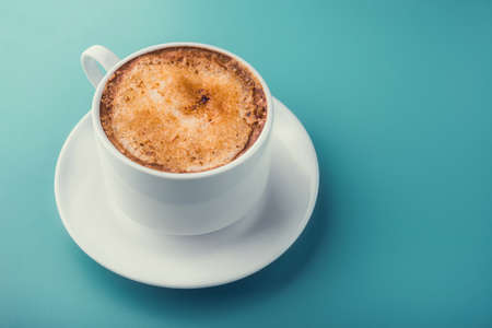 hot coffee cup on vintage background. morning breakfastの写真素材