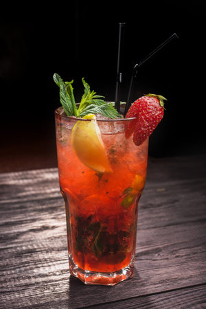 Strawberry Mojito with lemon and mint on tableの写真素材