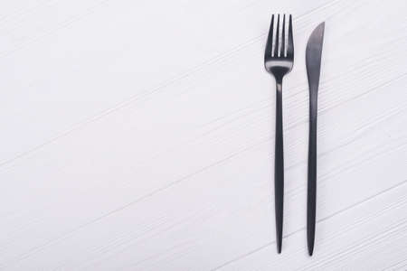 knife and fork on wooden table.cutlery on backgroundの写真素材