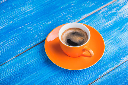 morning coffee cup on wood blue old table. tasty breakfast
