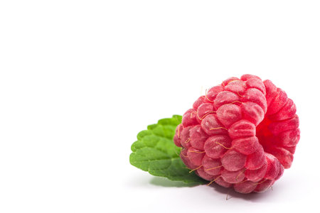 Macro photo of raspberry isolated on white background
