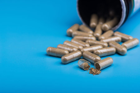 Herbal pills on a blue background. Bad supplement