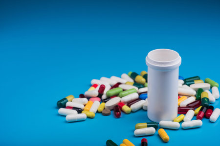 pharmaceutical pill and tablets on blue background