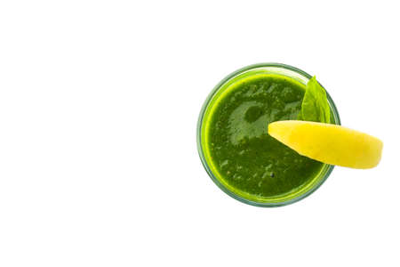 Green smoothie drink with apple isolated on white background. Vegetarian cocktail glass. top viewの写真素材